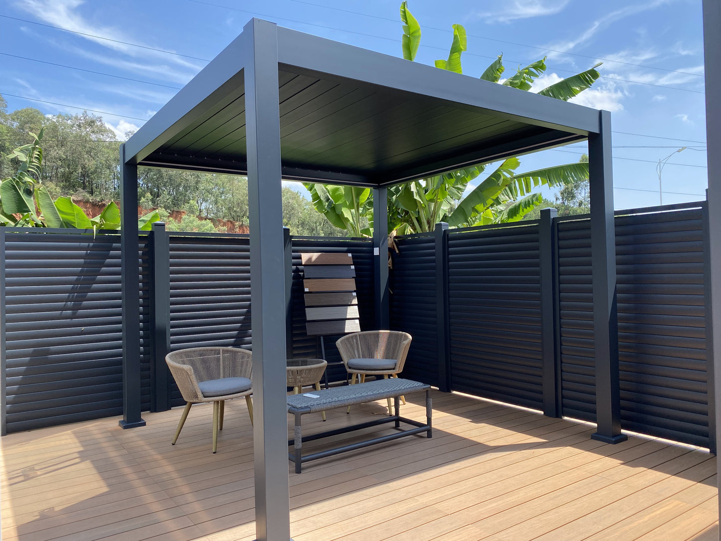 Free-standing louvered pergola in grey